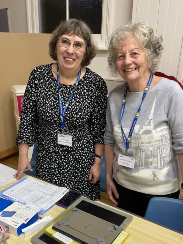 Sue and Heather on the Outings and Holiday desk December 2024